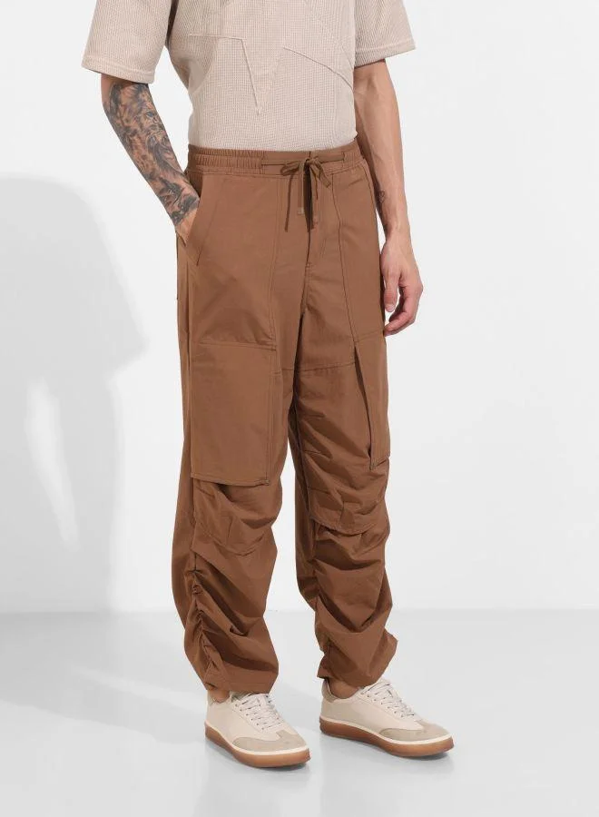 The Indian Garage Co  Men Baggy Fit Solid Cross Pocket Mid-Rise Trousers for Men | Best Price UAE
